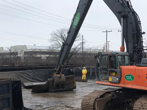 December 2019 - View looking North: Sheet steel is folded several times into manageable sections, then loaded into the roll-off containers. All steel is inspected by the EPA designee before loading into the container. 