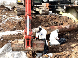 December 2019 - View looking southwest: Careful inspection is conducted by the certified asbestos contractor on every excavator bucket of soil to ensure asbestos has been removed. 