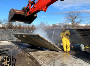 December 2019 - View looking north: Decontamination of mats. The mats are decontaminated prior to placement in staging area.