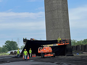 June 2021 - Wrapping concrete stack to limit debris at explosives elevation