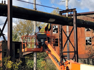 October 2019 - Site 108 -view looking west.  Asbestos inspection and survey of the elevated piping.