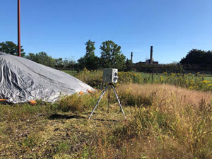 September 2019 - View looking north. Typical air monitoring station setup. Covered soil pile in the background.